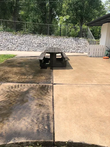 Before and after concrete pad cleaning